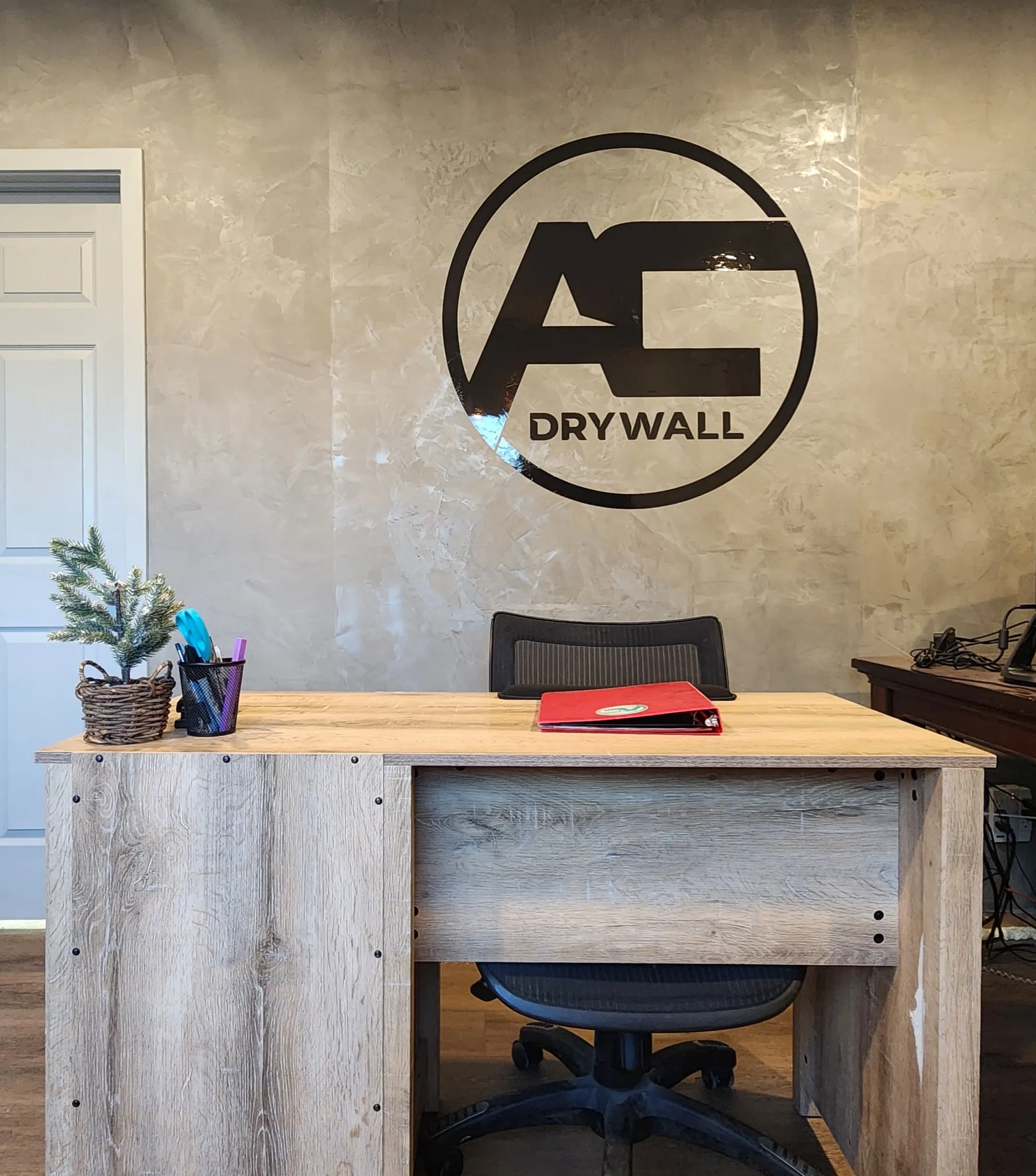 AvilaCo Drywall office featuring fresco harmony textured wall with company logo in Clark County WA