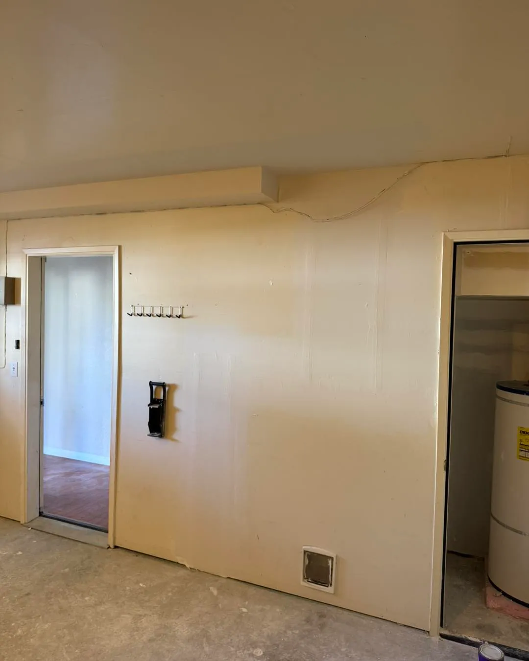 Basement utility room walls and ceiling fully patched, mudded and painted