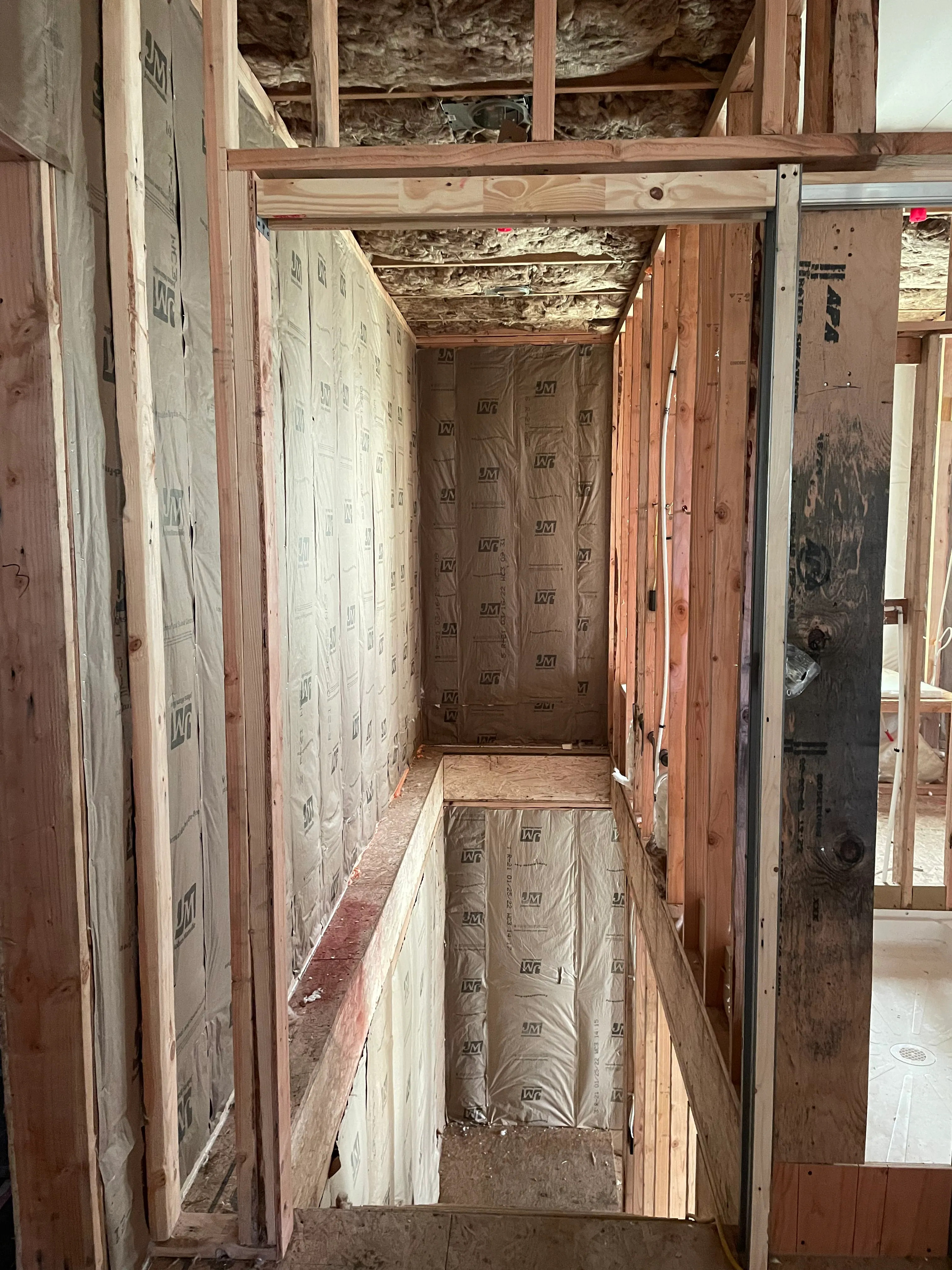 Batt insulation installed in wall cavity by AvilaCo Drywall crew