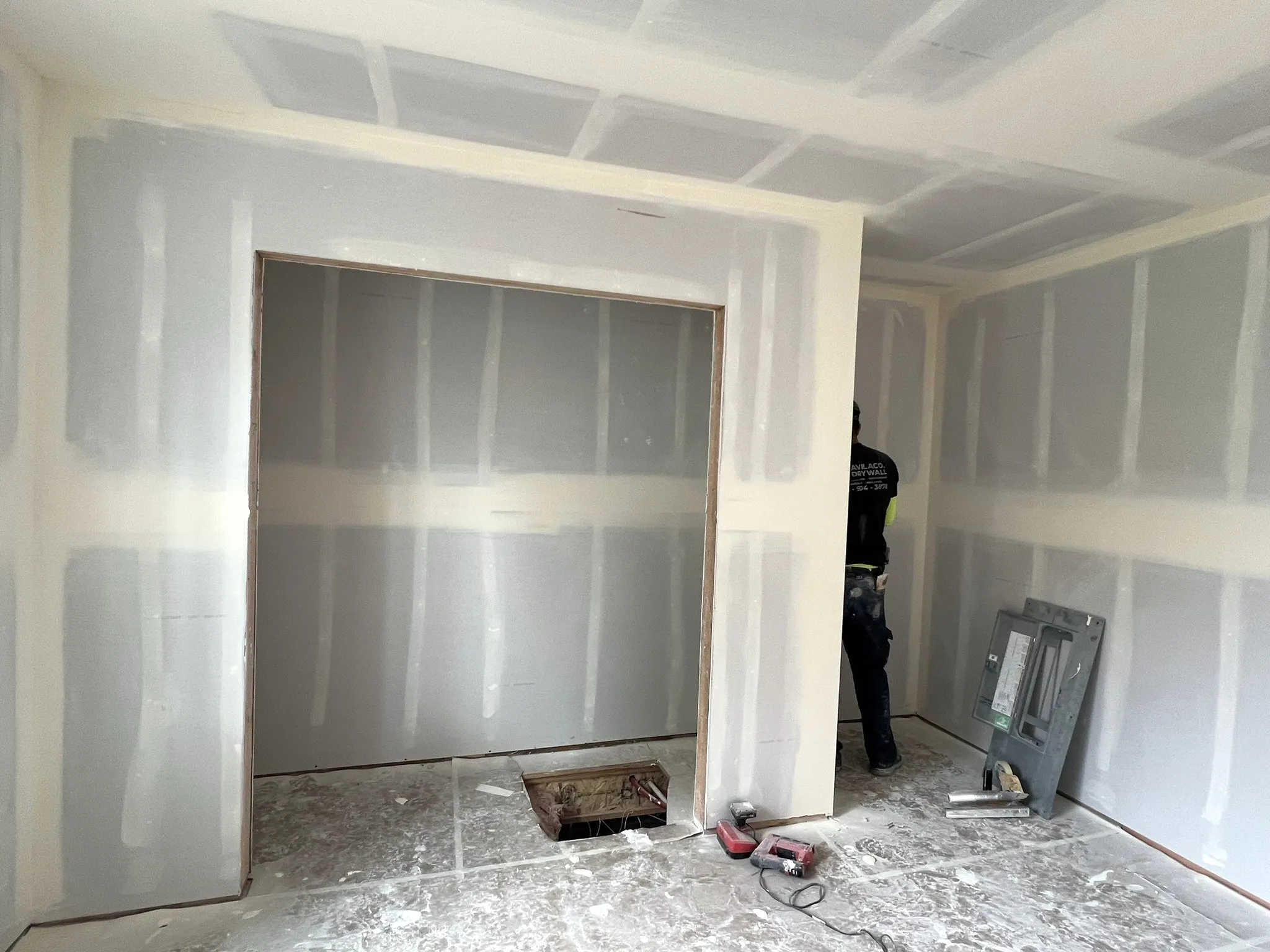 AvilaCo crew member taping drywall in a Ridgefield, WA new build