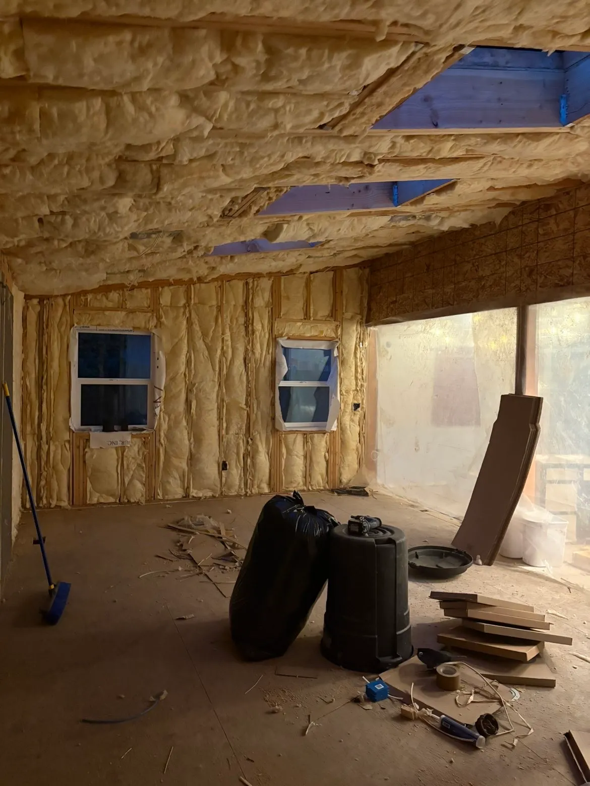 Close-up of insulation installation by AvilaCo Drywall crew in Battle Ground WA