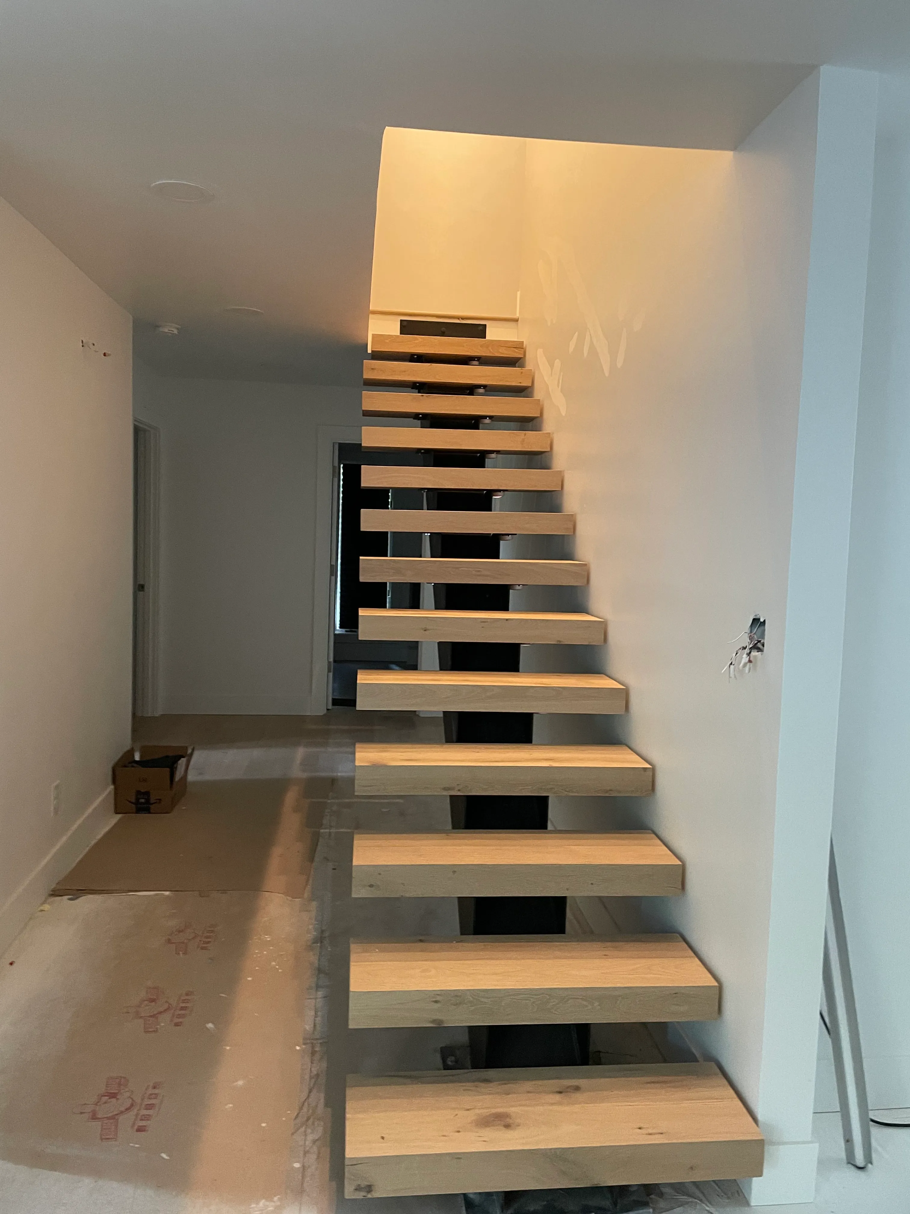 Modern staircase drywall installation in a Woodland, WA home