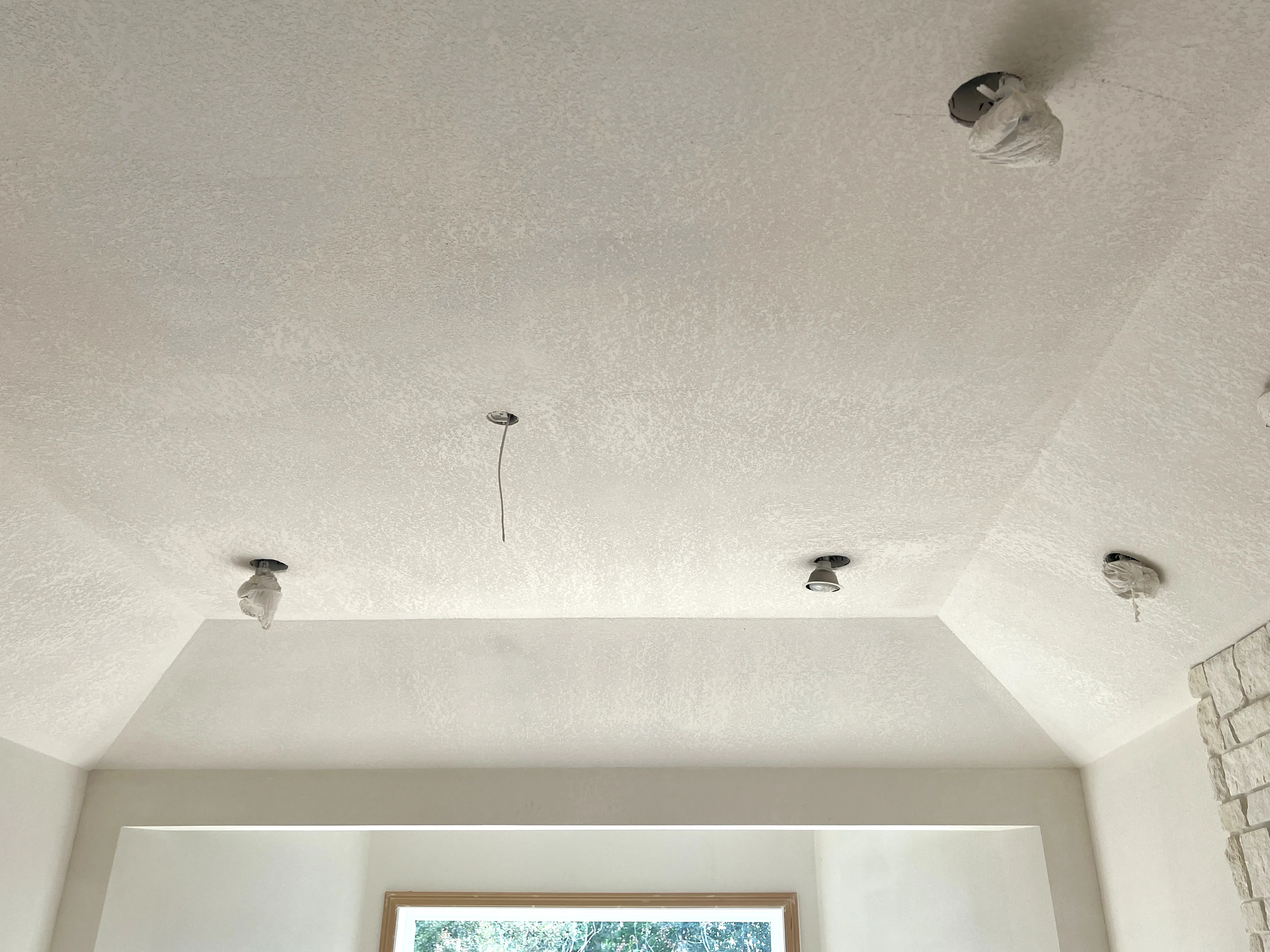 Smooth ceiling after popcorn texture removal in a Clark County home