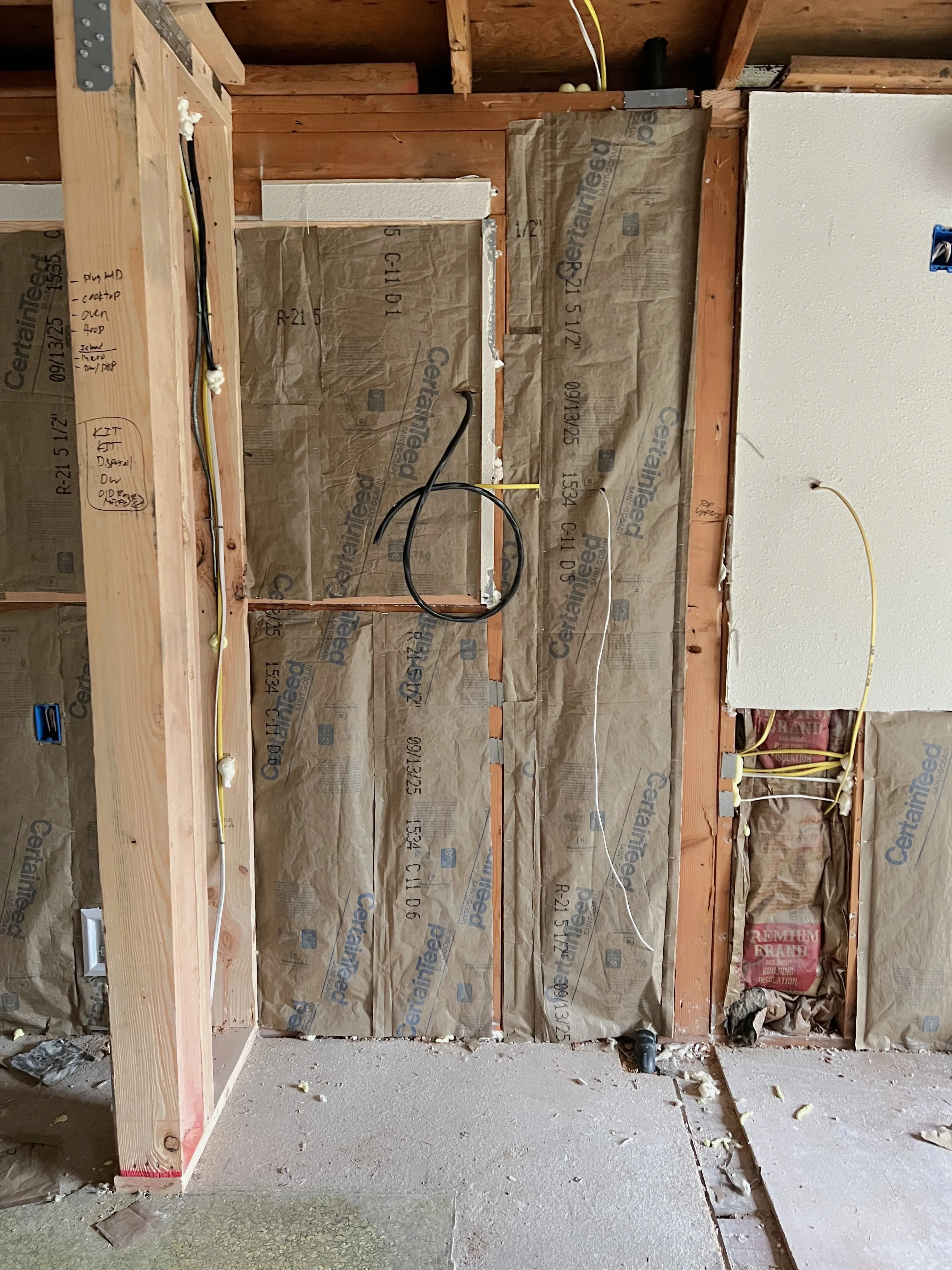 Batt insulation with vapor barrier installed in wall framing in Clark County WA home